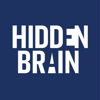 The cover art for Hidden Brain. The title is written in white all-caps sans-serif font on a navy blue background, but uses negative space to create some small optical illusions.